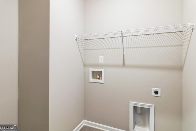 105 Ivy Glen Dr, Perry, GA 31069 - laundry area featuring electric dryer hookup, hookup for a washing machine, and wood finished floors