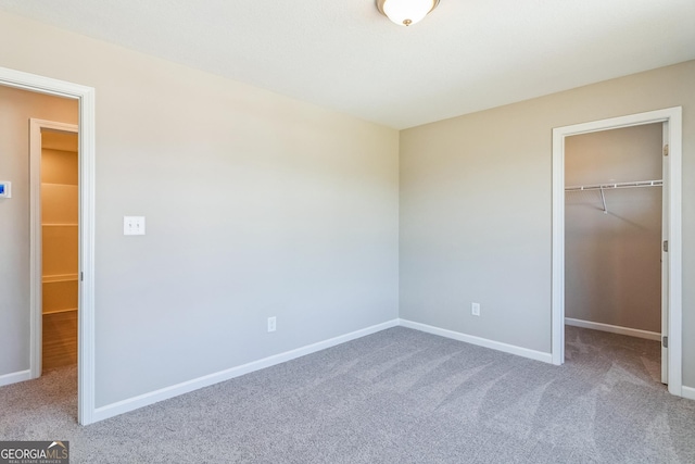 105 Ivy Glen Dr, Perry, GA 31069 - unfurnished bedroom with carpet floors, a spacious closet, and a closet