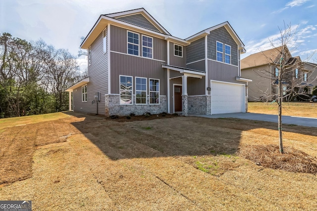 105 Ivy Glen Dr, Perry, GA 31069 - view of front facade with stone siding, an attached garage, and concrete driveway