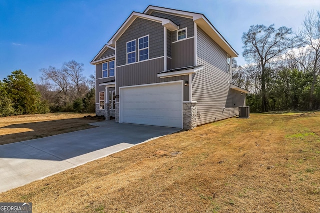 105 Ivy Glen Dr, Perry, GA 31069 - view of property exterior featuring concrete driveway, stone siding, a garage, and a lawn