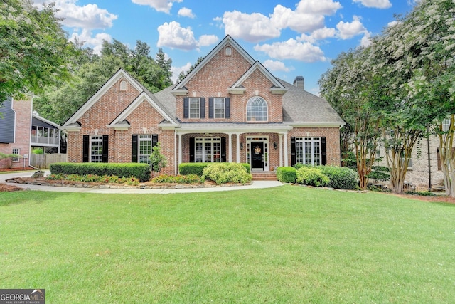 1640 Mount Mckinley Dr, Grayson, GA 30017 - view of front facade featuring brick siding and a chimney