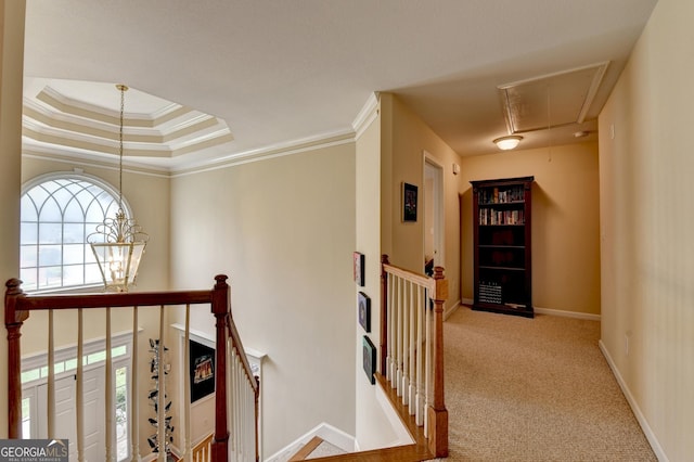 1640 Mount Mckinley Dr, Grayson, GA 30017 - hallway featuring attic access, an upstairs landing, a chandelier, carpet floors, and ornamental molding