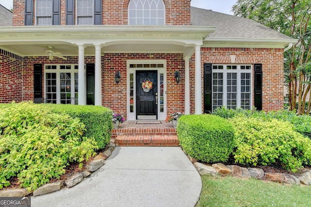 1640 Mount Mckinley Dr, Grayson, GA 30017 - view of exterior entry featuring brick siding, ceiling fan, and a shingled roof