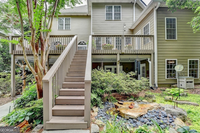1640 Mount Mckinley Dr, Grayson, GA 30017 - back of property with stairway and a wooden deck