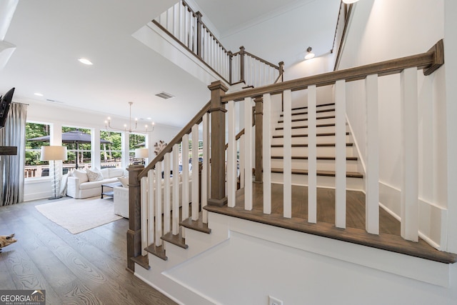 15755 Burdette Ct, Milton, GA 30004 - stairway with wood finished floors, recessed lighting, and a chandelier