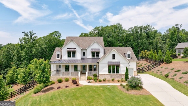 15755 Burdette Ct, Milton, GA 30004 - modern farmhouse style home with covered porch, concrete driveway, a standing seam roof, board and batten siding, and a metal roof