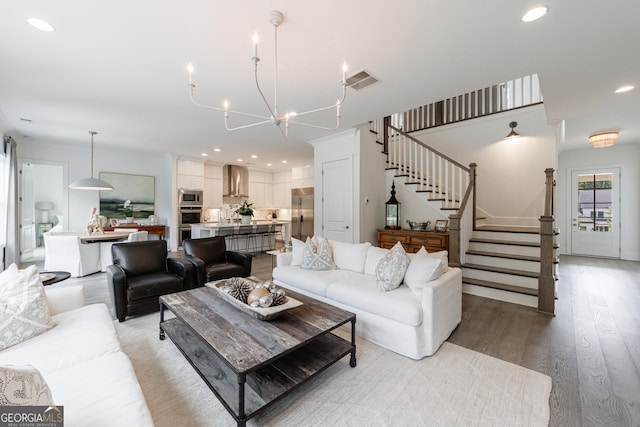 15755 Burdette Ct, Milton, GA 30004 - living area featuring light wood-style flooring, stairway, a chandelier, and recessed lighting