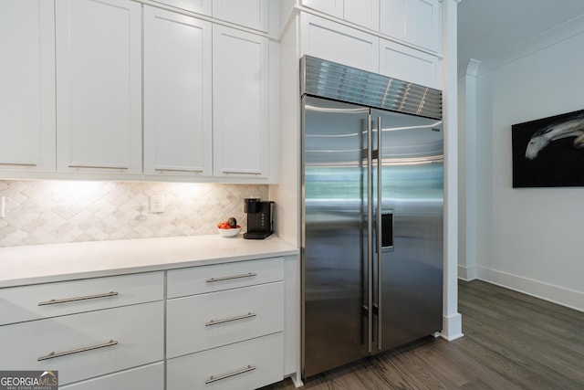 15755 Burdette Ct, Milton, GA 30004 - kitchen featuring stainless steel built in fridge, dark wood finished floors, tasteful backsplash, and white cabinetry