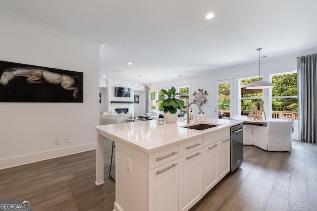15755 Burdette Ct, Milton, GA 30004 - kitchen featuring a center island with sink, dark wood finished floors, healthy amount of natural light, recessed lighting, and crown molding