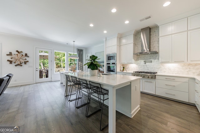 15755 Burdette Ct, Milton, GA 30004 - kitchen featuring wall chimney range hood, appliances with stainless steel finishes, light countertops, backsplash, and white cabinets