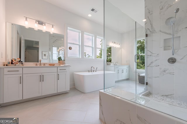 15755 Burdette Ct, Milton, GA 30004 - bathroom featuring a freestanding bath, two vanities, and a marble finish shower