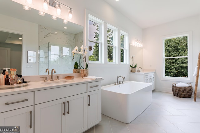 15755 Burdette Ct, Milton, GA 30004 - full bath with a marble finish shower, healthy amount of natural light, vanity, and a freestanding tub