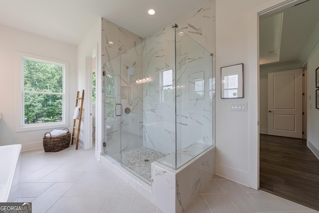 15755 Burdette Ct, Milton, GA 30004 - bathroom featuring a marble finish shower, tile patterned flooring, a soaking tub, and recessed lighting