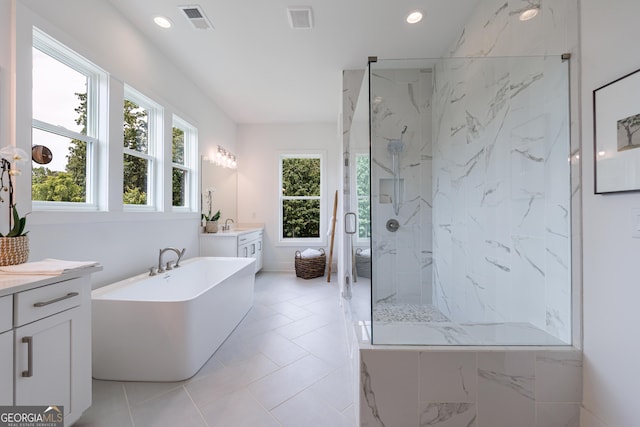 15755 Burdette Ct, Milton, GA 30004 - bathroom featuring vanity, a marble finish shower, a freestanding tub, and recessed lighting