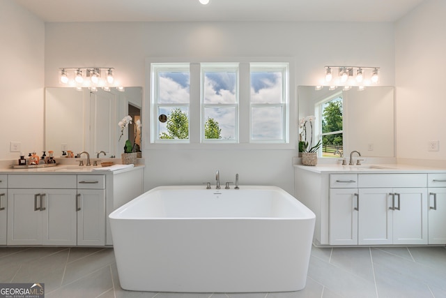 15755 Burdette Ct, Milton, GA 30004 - full bath with tile patterned floors, two vanities, and a soaking tub