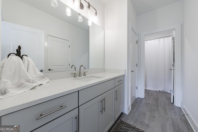 15755 Burdette Ct, Milton, GA 30004 - bathroom featuring vanity and wood finished floors