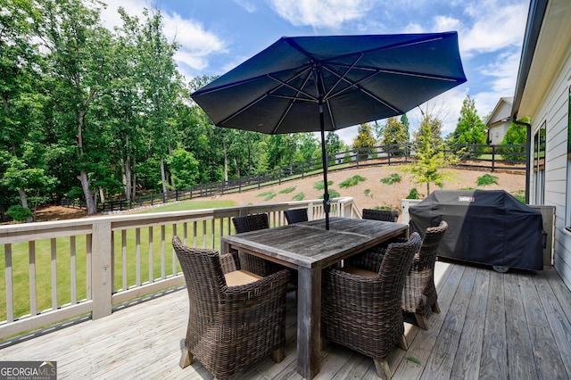 15755 Burdette Ct, Milton, GA 30004 - wooden deck featuring grilling area, outdoor dining space, and a fenced backyard