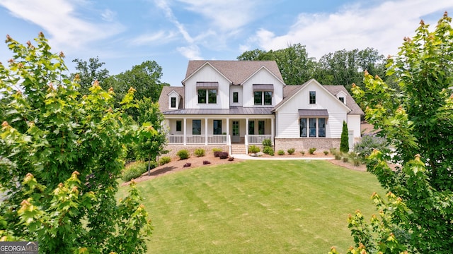 15755 Burdette Ct, Milton, GA 30004 - modern inspired farmhouse with a standing seam roof, a front lawn, stone siding, a porch, and a shingled roof