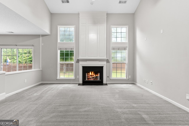 8750 Redford Ln, Suwanee, GA 30024 - unfurnished living room featuring carpet and a fireplace