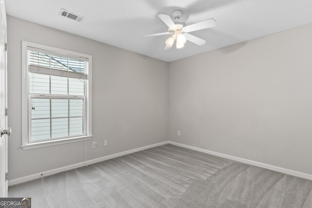 8750 Redford Ln, Suwanee, GA 30024 - carpeted spare room featuring a ceiling fan and baseboards