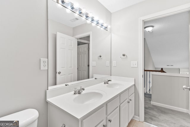 8750 Redford Ln, Suwanee, GA 30024 - bathroom featuring double vanity and tile patterned floors