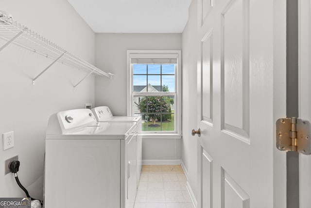 8750 Redford Ln, Suwanee, GA 30024 - laundry area featuring washing machine and dryer and light tile patterned flooring