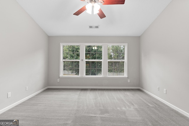 8750 Redford Ln, Suwanee, GA 30024 - empty room featuring a ceiling fan, carpet flooring, and lofted ceiling