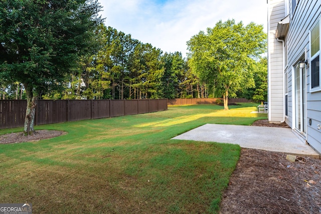 8750 Redford Ln, Suwanee, GA 30024 - fenced backyard featuring a patio area