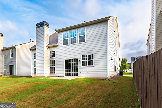 8750 Redford Ln, Suwanee, GA 30024 - rear view of house featuring a chimney and a patio area