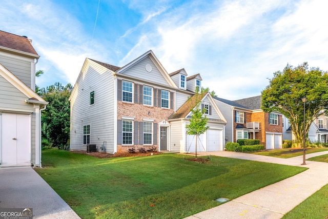 8750 Redford Ln, Suwanee, GA 30024 - view of front of house with concrete driveway, a front yard, an attached garage, and a residential view