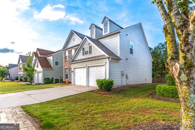 8750 Redford Ln, Suwanee, GA 30024 - view of home's exterior featuring driveway, a garage, a lawn, and roof with shingles