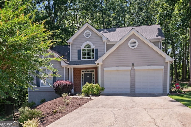 9720 Laguna Pl, Gainesville, GA 30506 - view of front of house with concrete driveway, a garage, and a shingled roof