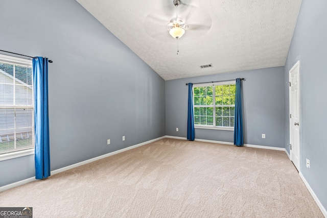 5832 Sycamore Ridge Dr, Sugar Hill, GA 30518 - unfurnished room with carpet floors, a textured ceiling, lofted ceiling, and ceiling fan