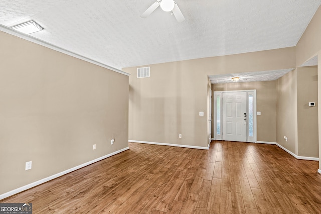 5832 Sycamore Ridge Dr, Sugar Hill, GA 30518 - foyer with ceiling fan, wood finished floors, and a textured ceiling