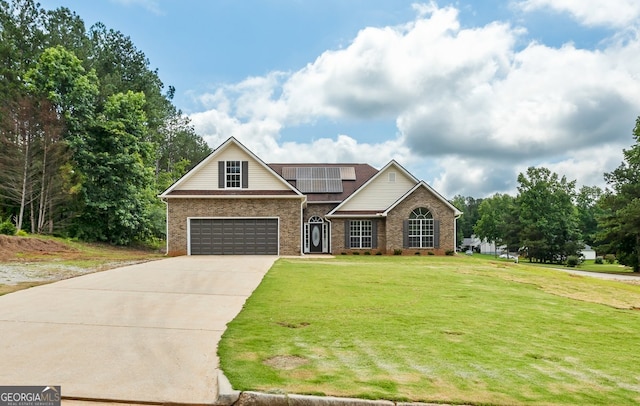 501 Llewellyn Ct, Jenkinsburg, GA 30234 - traditional-style home featuring a front lawn, roof mounted solar panels, driveway, and brick siding