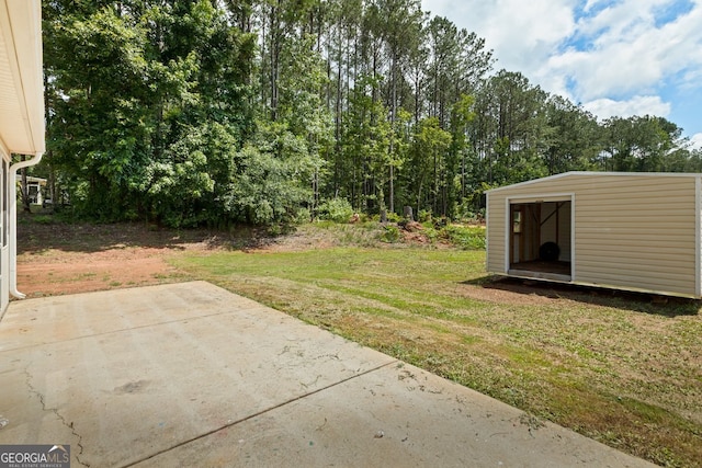 501 Llewellyn Ct, Jenkinsburg, GA 30234 - view of green lawn with a patio area and a storage shed