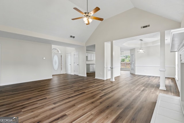 501 Llewellyn Ct, Jenkinsburg, GA 30234 - unfurnished living room with high vaulted ceiling, a ceiling fan, dark wood-style flooring, and decorative columns
