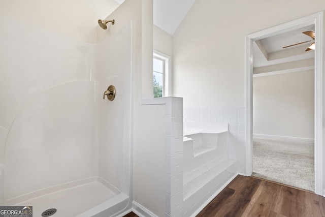 501 Llewellyn Ct, Jenkinsburg, GA 30234 - bathroom featuring wood finished floors, a shower, lofted ceiling, a ceiling fan, and a bathtub