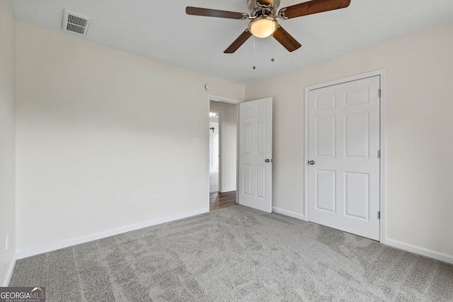501 Llewellyn Ct, Jenkinsburg, GA 30234 - unfurnished bedroom with carpet flooring and ceiling fan