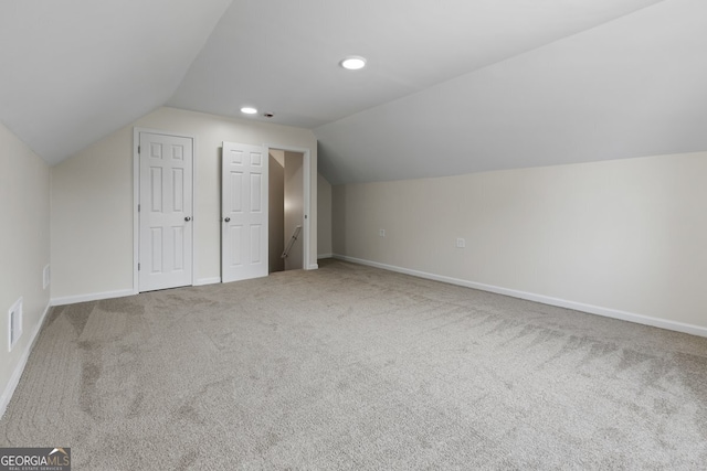 501 Llewellyn Ct, Jenkinsburg, GA 30234 - additional living space with carpet and vaulted ceiling
