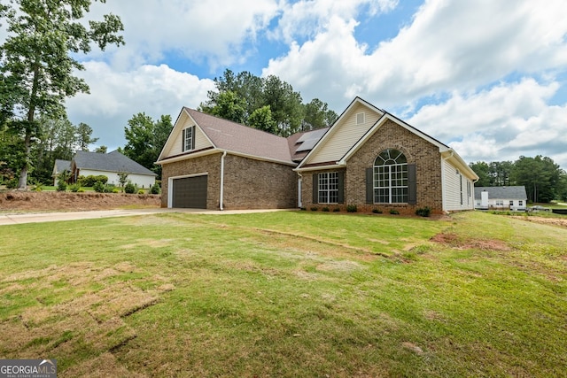 501 Llewellyn Ct, Jenkinsburg, GA 30234 - single story home with solar panels, driveway, brick siding, a front yard, and a garage
