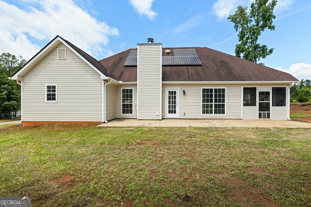 501 Llewellyn Ct, Jenkinsburg, GA 30234 - back of house featuring a yard, a patio, a chimney, and solar panels