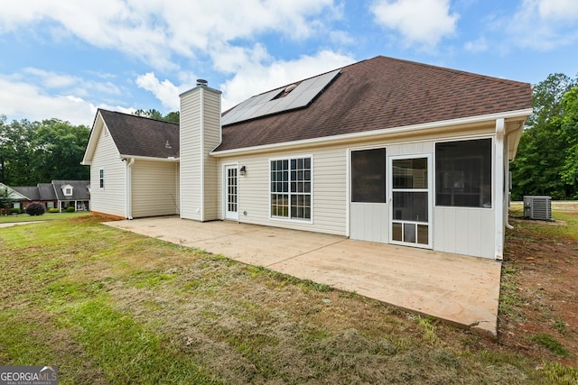 501 Llewellyn Ct, Jenkinsburg, GA 30234 - rear view of house with a patio area, solar panels, a lawn, and a chimney