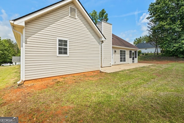 501 Llewellyn Ct, Jenkinsburg, GA 30234 - back of property featuring a chimney, a patio, and a yard