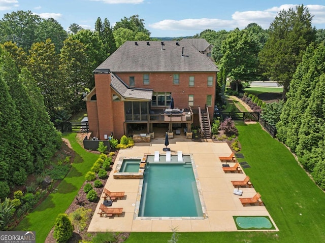 560 Arcaro Dr, Milton, GA 30004 - rear view of house featuring a pool with connected hot tub, a patio area, and stairs