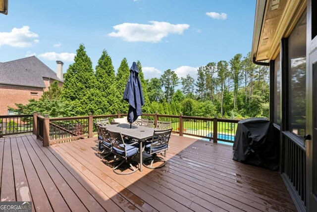 560 Arcaro Dr, Milton, GA 30004 - deck featuring outdoor dining space and a sunroom