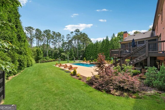 560 Arcaro Dr, Milton, GA 30004 - swimming pool featuring a deck, stairway, a lawn, and a patio area