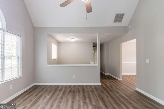 1404 Lancaster Ct, Mcdonough, GA 30252 - unfurnished room with plenty of natural light, vaulted ceiling, wood finished floors, and a ceiling fan