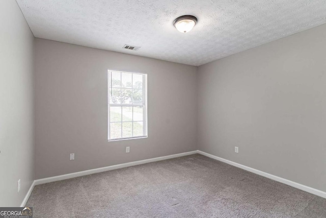 1404 Lancaster Ct, Mcdonough, GA 30252 - carpeted empty room featuring baseboards and a textured ceiling