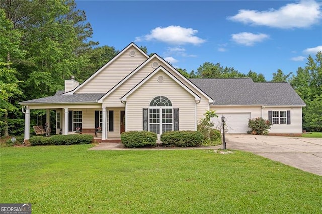 2333 Old Newnan Rd, Carrollton, GA 30116 - view of front of home featuring driveway, covered porch, a front lawn, a chimney, and an attached garage